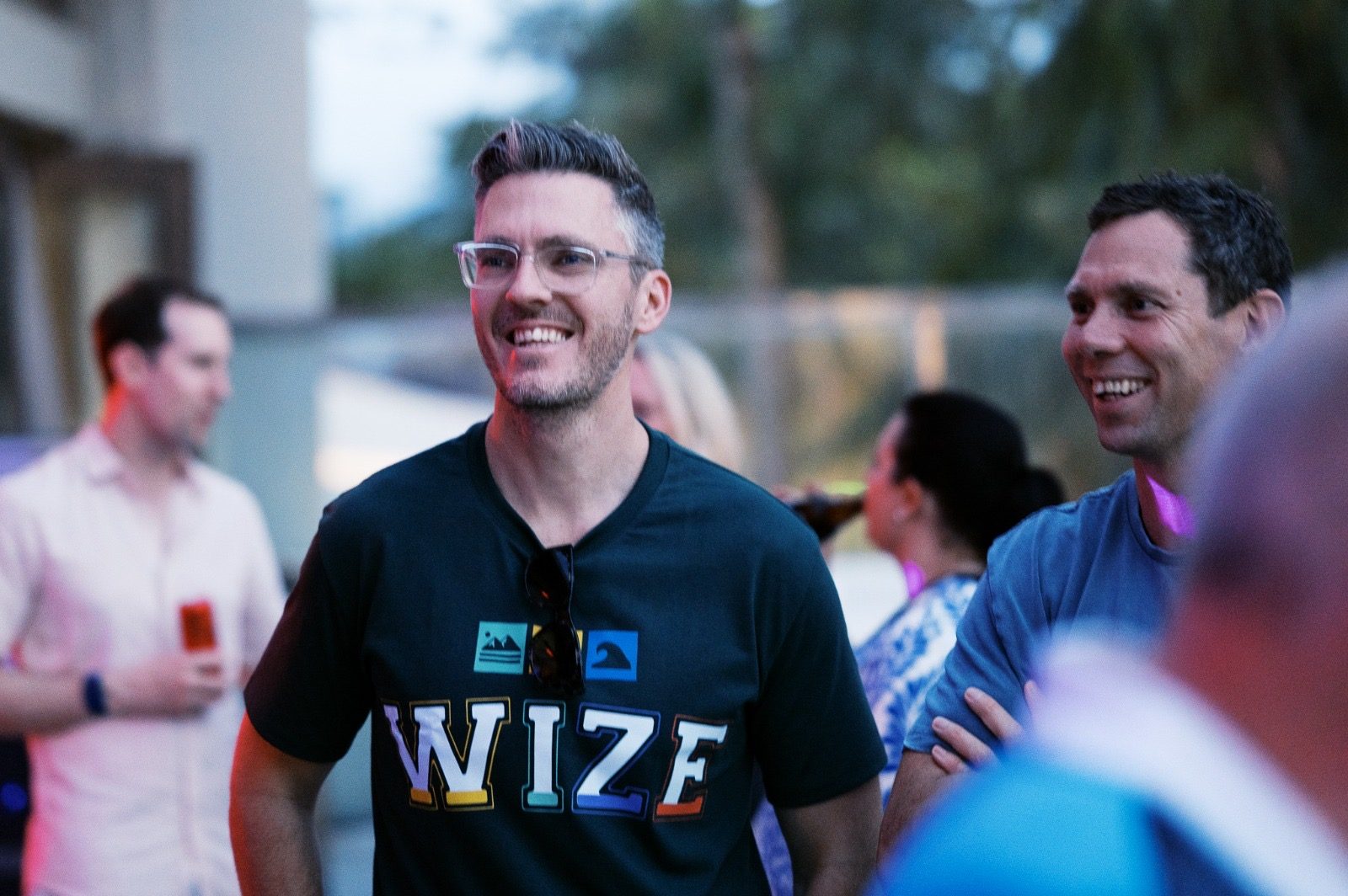 Bren and Jamie laughing together at an evening event
