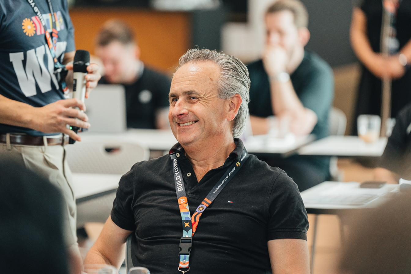 A workshop attendee smiling